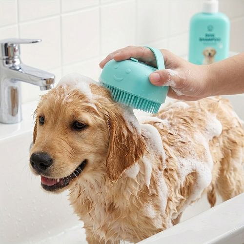 Dog being bathed with a green brush in a sink
