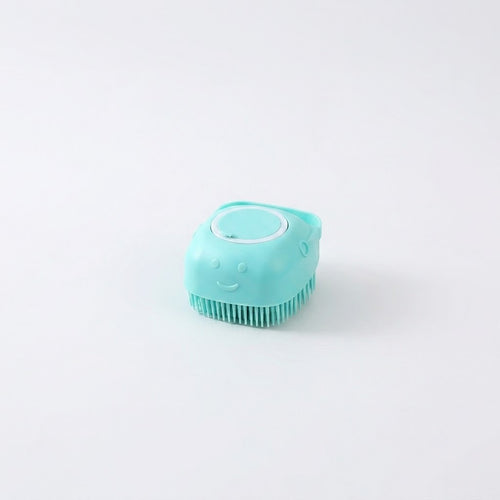 Turquoise silicone scrubber on a light gray background